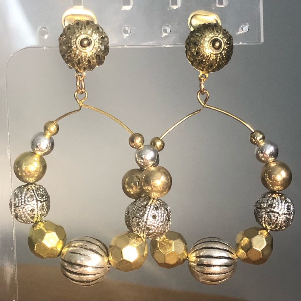 Wire loop clip on earrings with gold and silver tone beads.